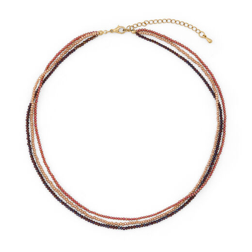 A delicate beaded necklace with layered strands of pink, purple and orange glass beads.