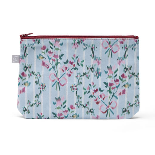 Cotton pouch featuring a pattern of pink flowers and red bows on a pastel blue background.