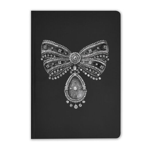 A black notebook featuring a bow-shaped brooch of carved rock crystal and diamond 