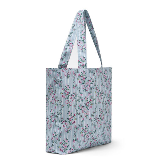A spacious pastel blue tote bag featuring a deep gusset and a floral pattern.