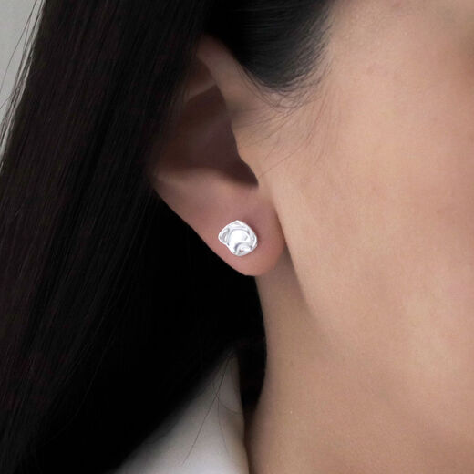 Silver teardrop stud earrings by Mounir