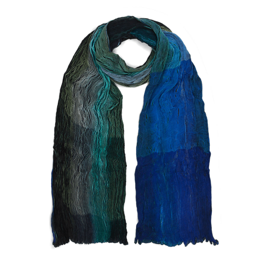 A green and blue pleated scarf against a white background. The scarf is rolled up to mimic the shape when worn around the neck.