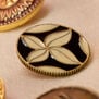 Black and white enamel coat button