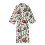 The back of a dressing gown featuring a floral pattern complete with a waist belt.