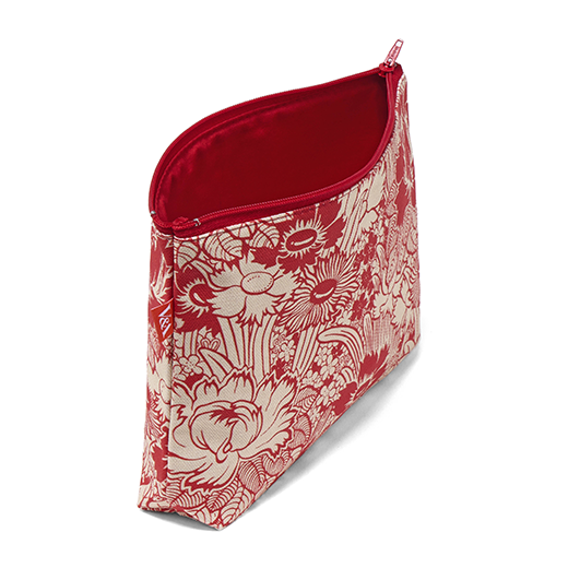 A travel pouch featuring a red and white floral pattern, photographed on a white background with the zip opened to show the red inner lining.