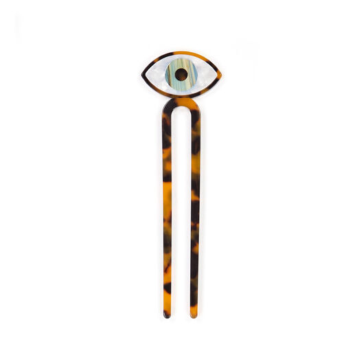 Cellulose hair pin topped by a blue eye 