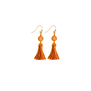 A pair of hook earrings featuring orange tassel suspended on a round bead.
