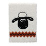 Lined A5 notebook with plushie white cover and illustration of Shaun the Sheep