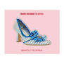 A shoe shaped magnet on pink backing card. The shoe features a striped blue and white design and a blue bow at the front.