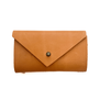 A needle case in ochre leather.