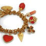 Red charm bracelet by Katerina Psoma