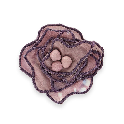 Brooch featuring a recycled textile and ebroidered pink flower