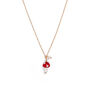 A chain necklace with a small red mushroom pendant.
