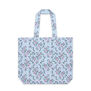 A pastel blue large tote bag featuring a pattern with pink flowers and red bows.