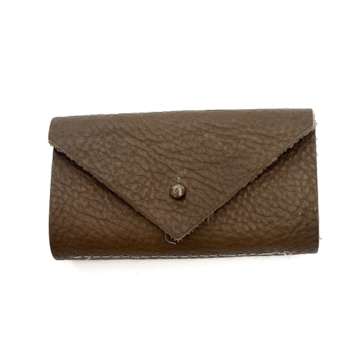 An olive leather needle case cut against a white background.