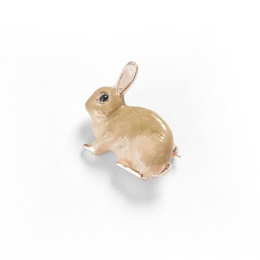 A handpainted enamel rabbit shaped brooch.