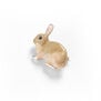 A handpainted enamel rabbit shaped brooch.