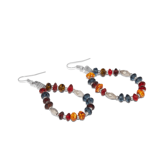 A pair of hook earrings with multicoloured beads arranged in a drop shape lying on a white surface.