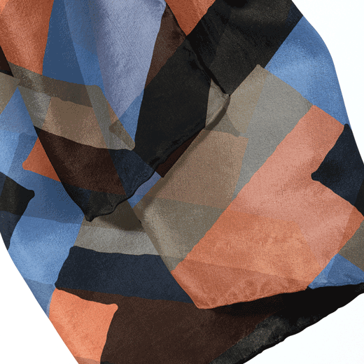 Close up of a scarf featuring a zigzag Art Deco pattern.