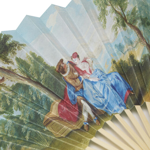 Close up of a scene of a couple in court dresses, set in a lush landscape.