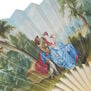 Close up of a scene of a couple in court dresses, set in a lush landscape.