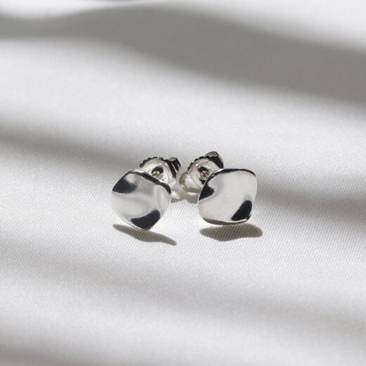 Silver teardrop stud earrings by Mounir