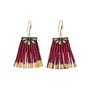 A pair of fan shaped earrings made with strands of burgundy textile and gold detailing.
