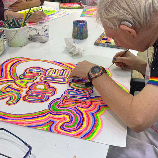 ARTHOUSE Unlimited artist Stephen Thomson while painting his artwork.