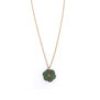 A gold chain necklace with a green flower shape pendant.