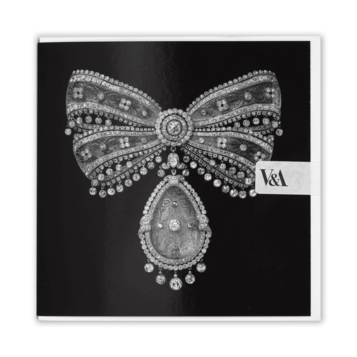 A square black greetings card featuring a striking ribbon-shaped brooch of carved rock crystal and diamonds