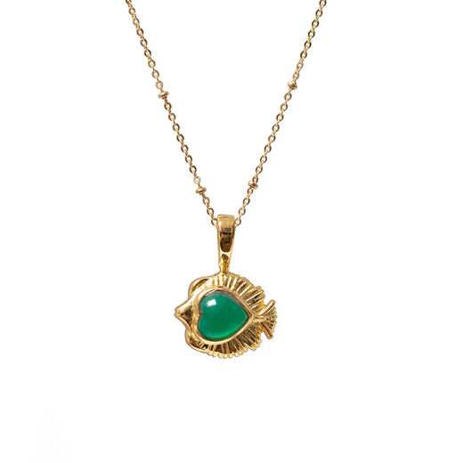 A gold chain necklace with a gold fish shaped pendant featuring a green onyx at its centre.