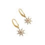 A pair of gold plated earrings, each featuring a star shaped pendant with crystals.