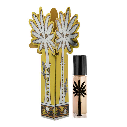 A roll on perfume in a clear glass bottle with a black cap. Next to it a decorated paper box.