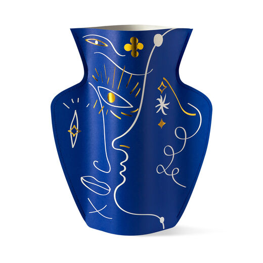 Blue paper vase featuring abstract face silhouettes 