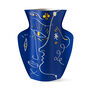 Blue paper vase featuring abstract face silhouettes 