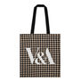 This stylish pink houndstooth tote bag is perfect for everyday use