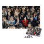 A complete jigsaw puzzle featuring the photograph of a crowd of people. An image of the jigsaw box is pasted on the bottom right corner of the frame.