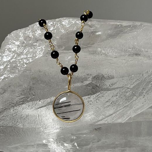 Rutilated quartz and black onyx rosary necklace by Mirabelle