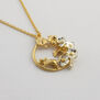 Mouse in floral loop necklace by Alex Monroe