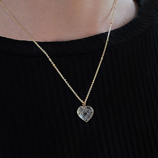 Carved crystal heart pendant necklace by Mirabelle