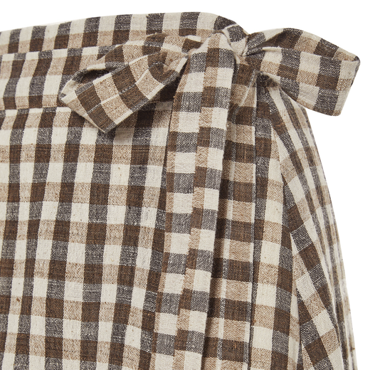 A detail of a brown and blue check bow.