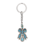 Metal keyring featuring a blue bow design