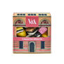 A box of liquorice allsorts featuring a print of the V&A museum's facade.