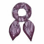 A looped purple scarf with a print featuring an intricate illustration of jewellery items.