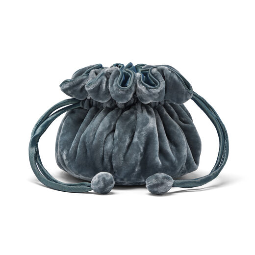 Blue velvet drawstring pouch for storing jewellery.
