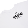 The back collar of a white t-shirt, bearing the text NAOMI In Fashion printed in black. 