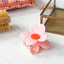 Pink daisy hair claw