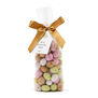 A see through packet of mini chocolate Easter eggs in an assortment of pastel colours.