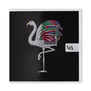 A square black greetings card featuring a flamingo-shaped brooch made of diamonds and coloured gemstones