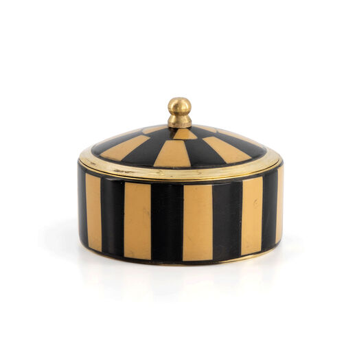 A trinket box in the shape of a black and brown striped circus tent.